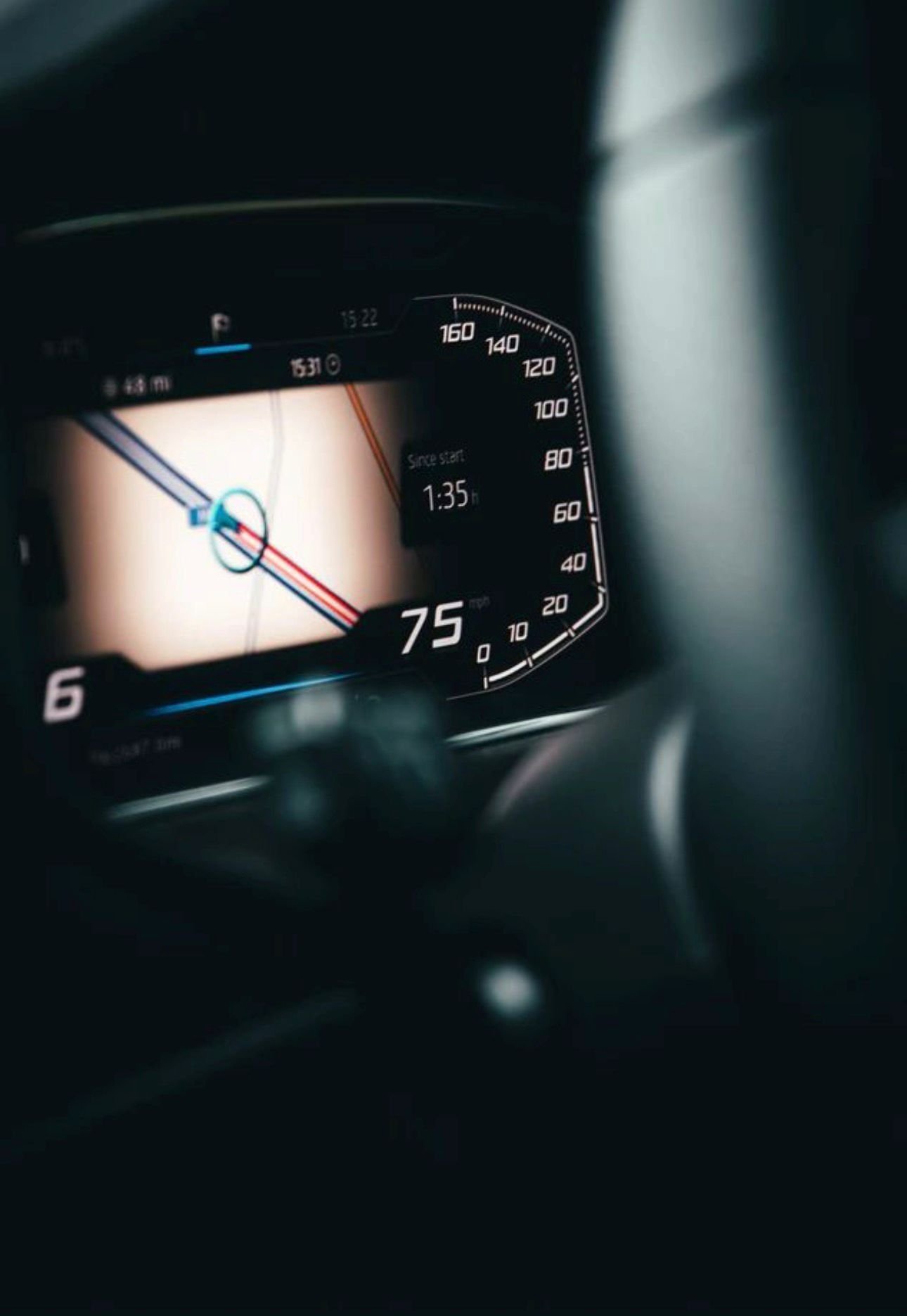 Digital car dashboard showing speedometer at 75 mph and navigation map display with directional arrows